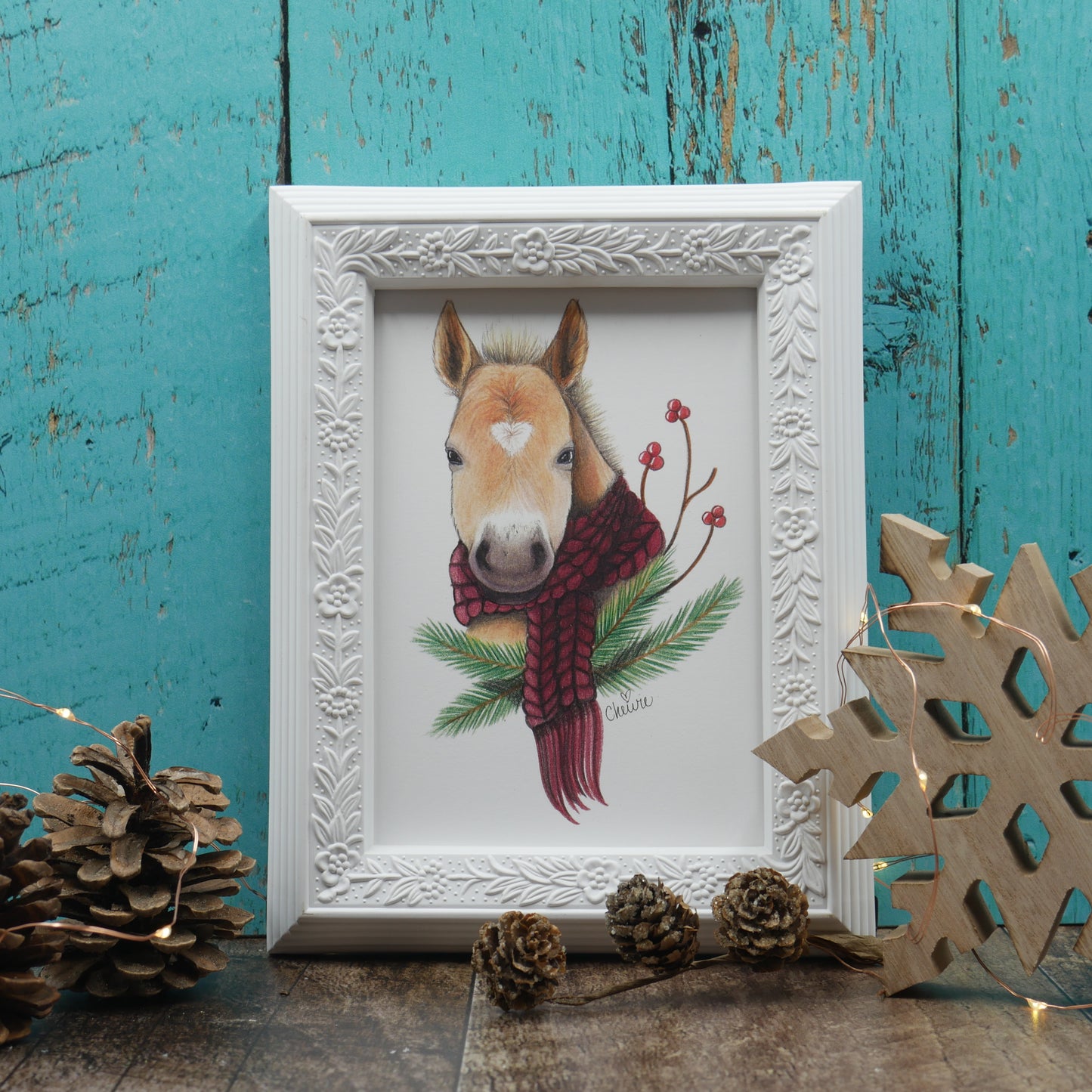 Affiche cheval blond avec foulard rouge et branches de sapin