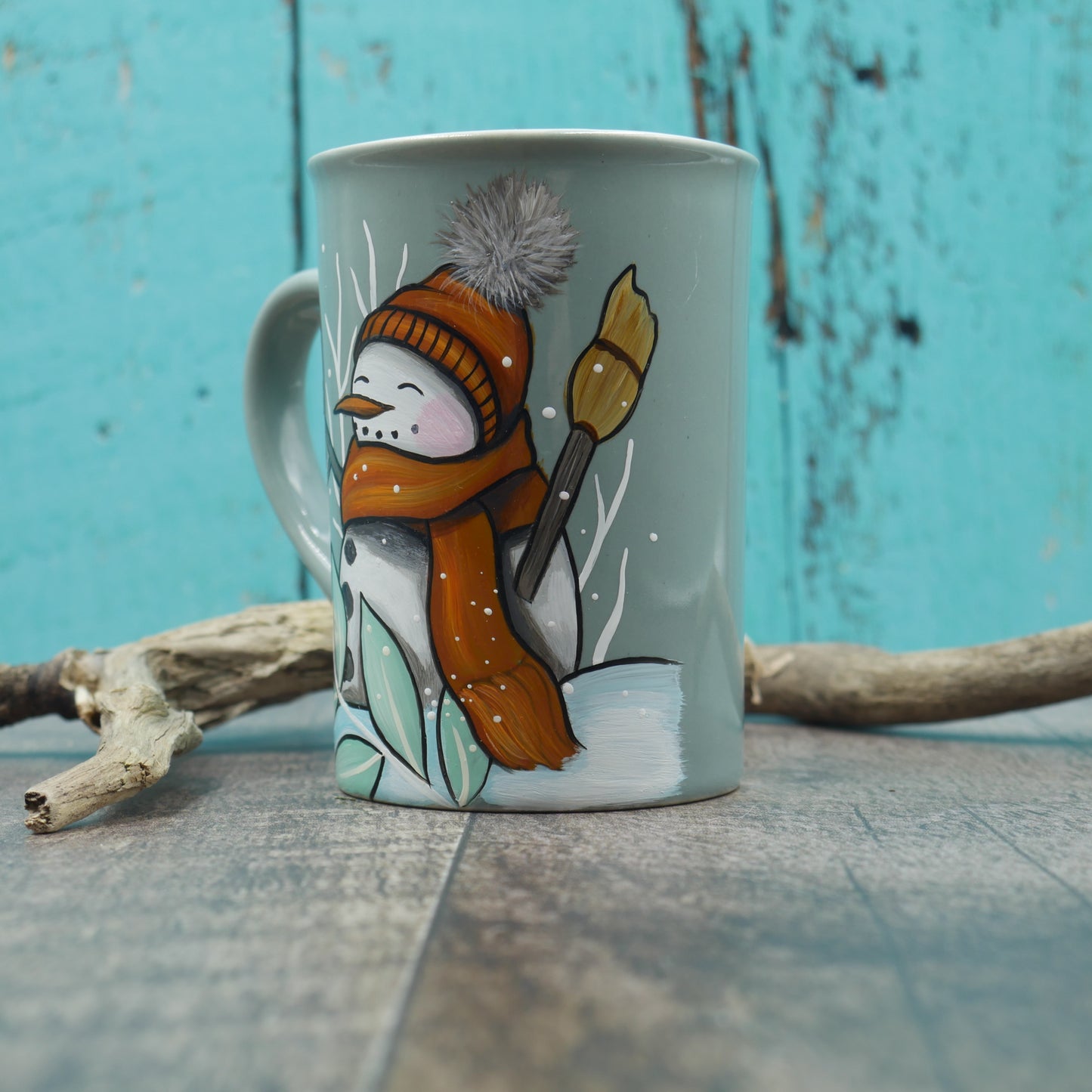 Petite tasse turquoise bonhomme de neige avec foulard