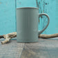 Petite tasse turquoise bonhomme de neige avec foulard