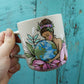 Tasse mère nature entourée de fleurs roses et de verdure