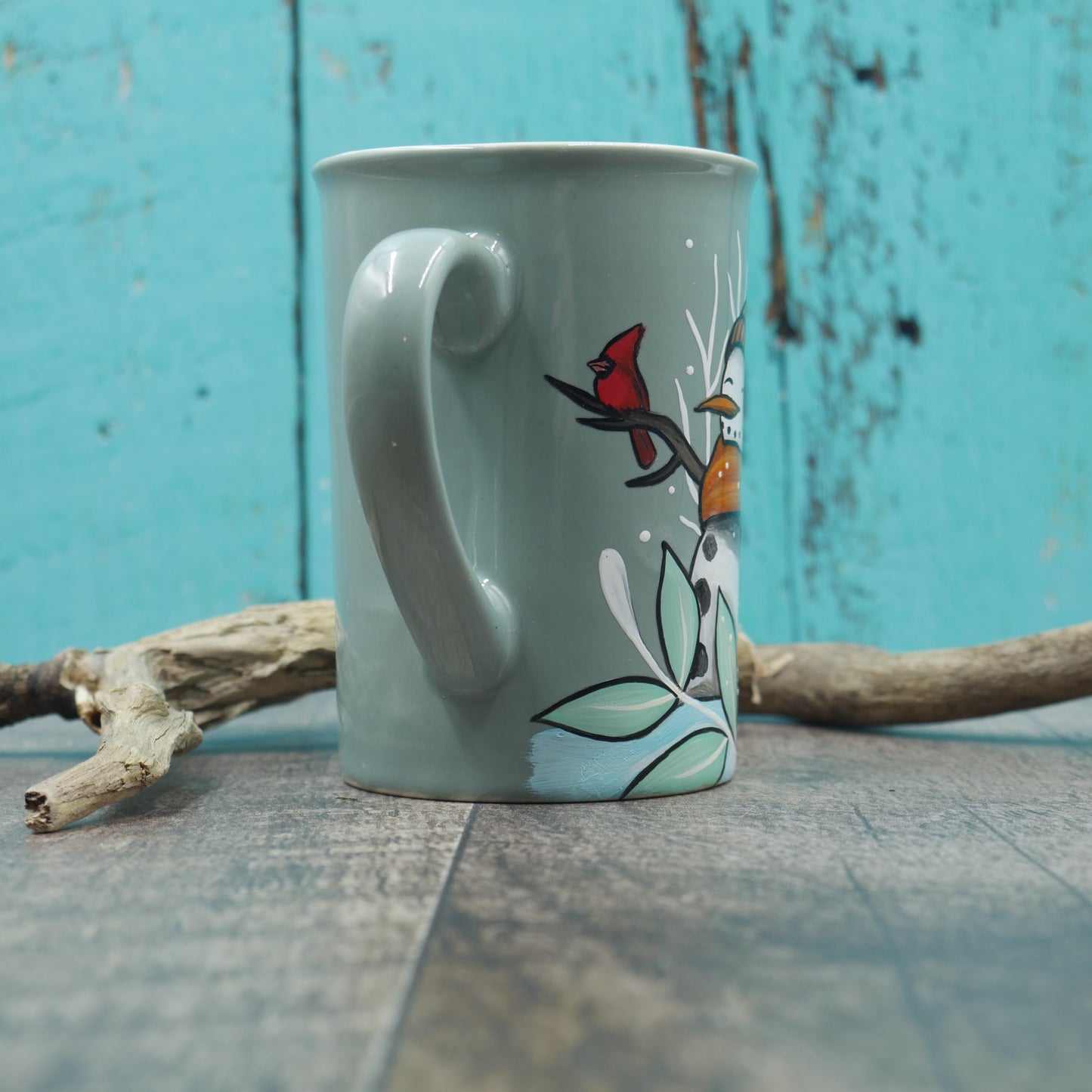 Petite tasse turquoise bonhomme de neige avec foulard
