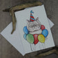 carte de souhaits chat avec chapeau de fête et ballons