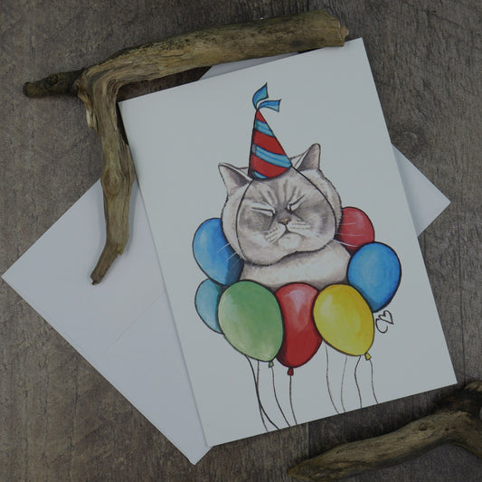 carte de souhaits chat avec chapeau de fête et ballons
