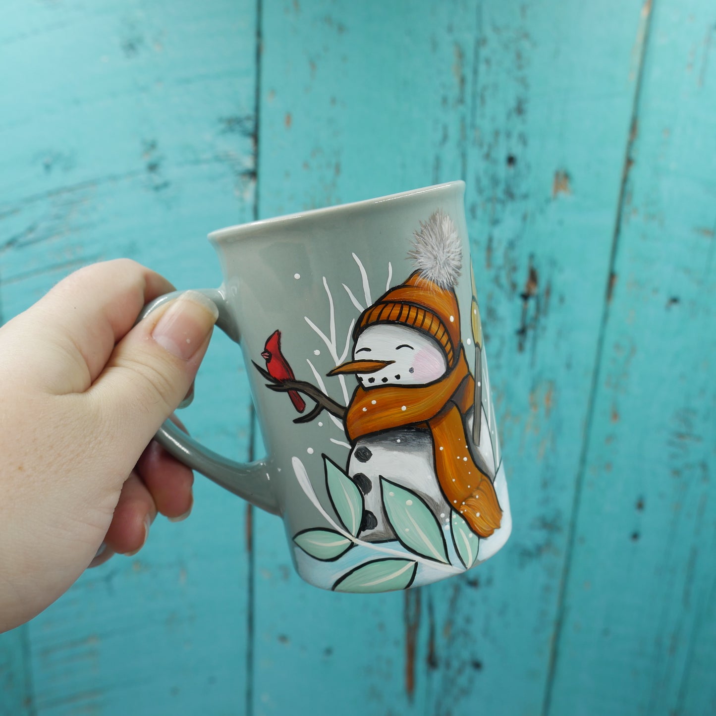 Petite tasse turquoise bonhomme de neige avec foulard