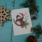 Carte de vœux mésange à tête noire avec chapeaux de Noël et branches de sapin